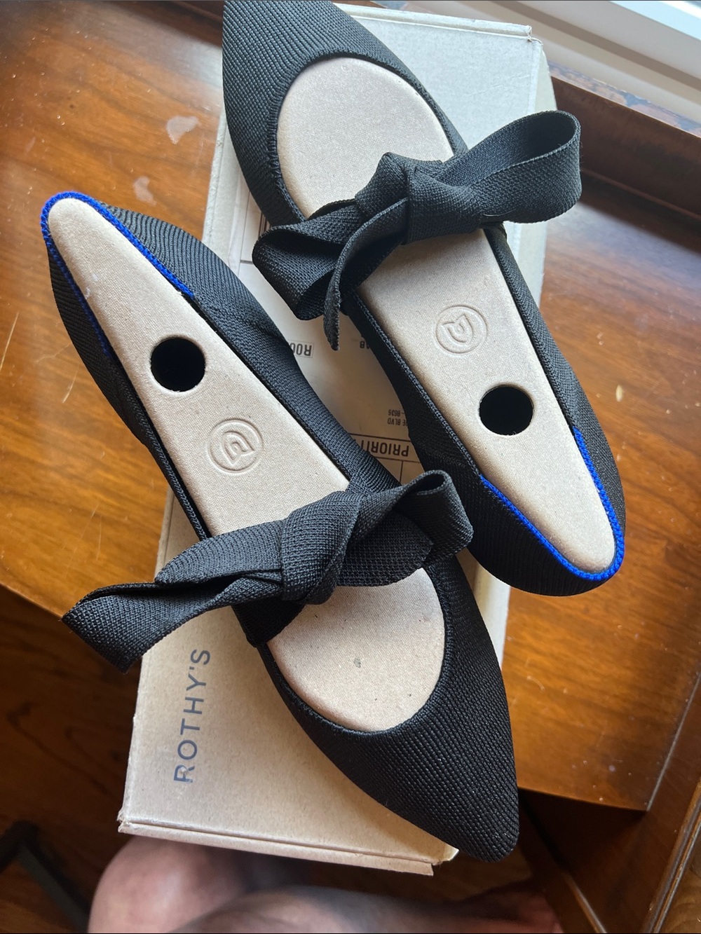 Rothy's Black Pointed Bow Flats with signature Blue Trim